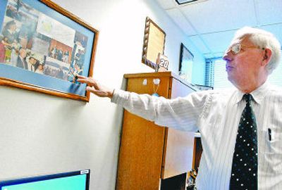
Tony Stewart, a political science instructor at North Idaho College, points out memorabilia in his office relating to human rights events. 
 (Jesse Tinsley / The Spokesman-Review)