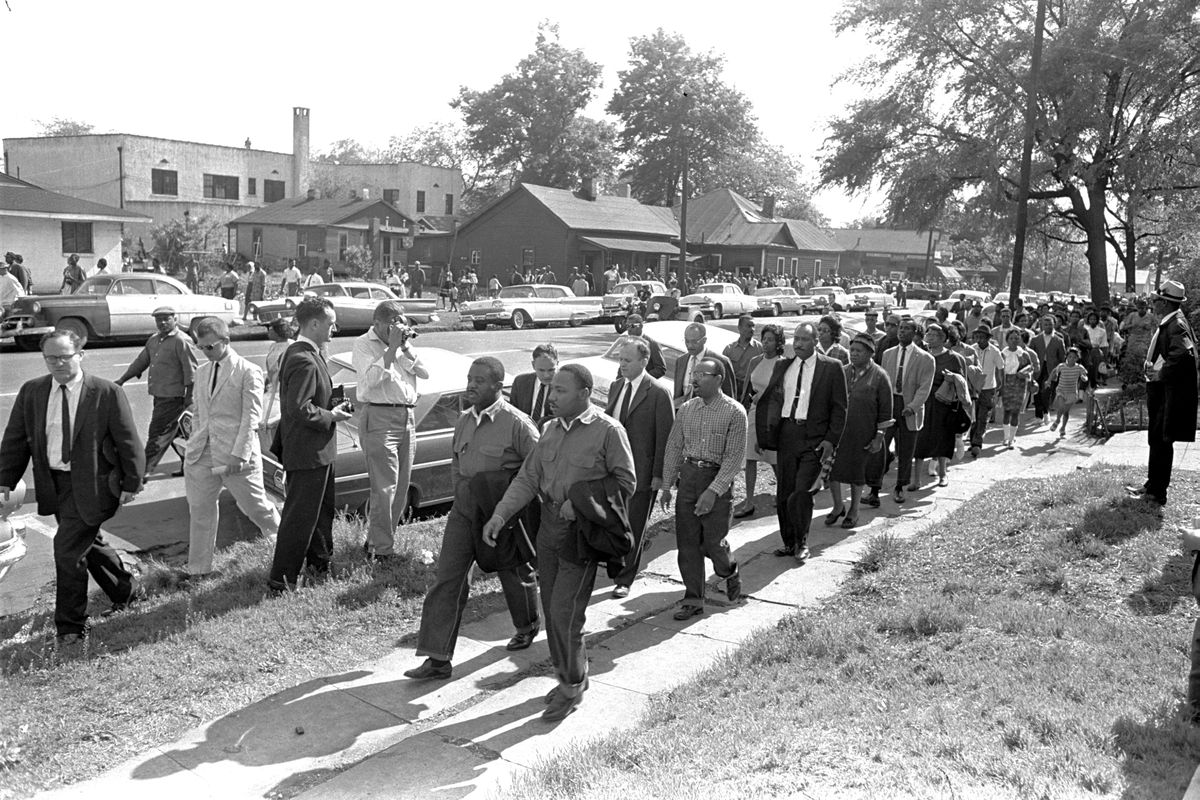 In this file photo taken April 12, 1963 Rev. Ralph Abernathy, left, and Rev. Martin Luther King Jr. lead a column of demonstrators as they attempt to march on Birmingham, Ala., City Hall. Arrested for leading a march against racial segregation in 1963, King Jr. spent days in solitary confinement writing his “Letter From Birmingham Jail,” which was smuggled out and stirred the world by explaining why Black people couldn