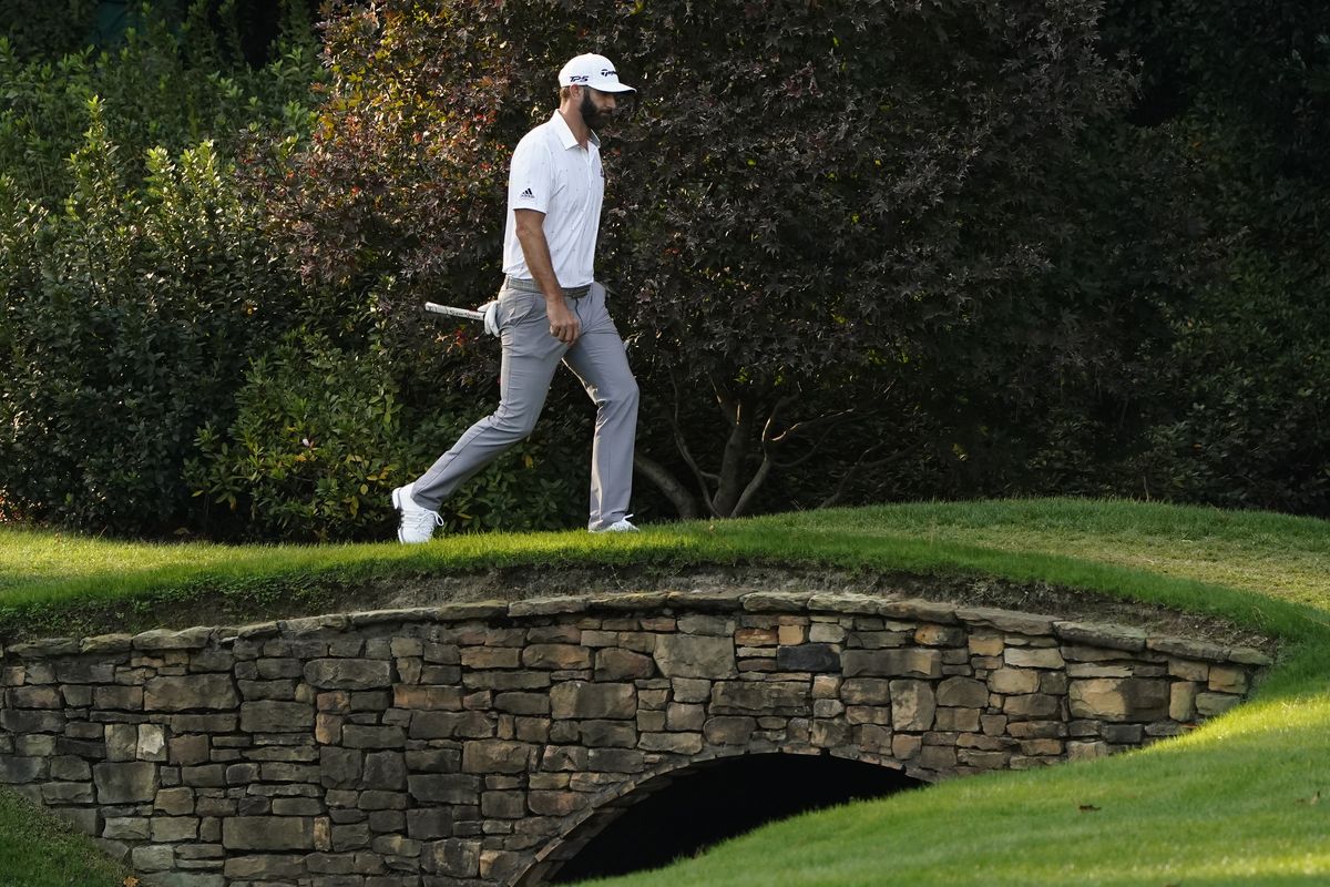Dustin Johnson walks to the 14th green during the third round of the Masters golf tournament Saturday in Augusta, Ga.  (Associated Press)