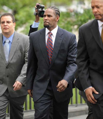 
R&B musician R. Kelly arrives at the Cook County building in Chicago, Ill., for the first day of arguments for his child pornography trial Tuesday. The singer has pleaded not guilty.Associated Press
 (Associated Press / The Spokesman-Review)