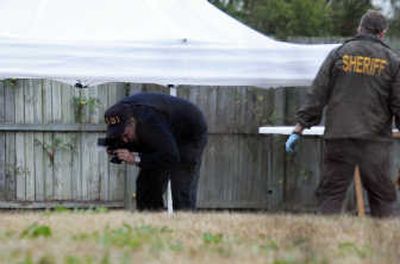 
Authorities on Saturday examine the Jacksonville, N.C., backyard of Marine Cpl. Cesar Armando Laurean, where  Lance Cpl. Maria Lauterbach's remains were found in a fire pit.Associated Press
 (Associated Press / The Spokesman-Review)