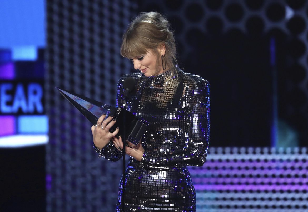 Taylor Swift wins big at AMAs and encourages fans to vote The