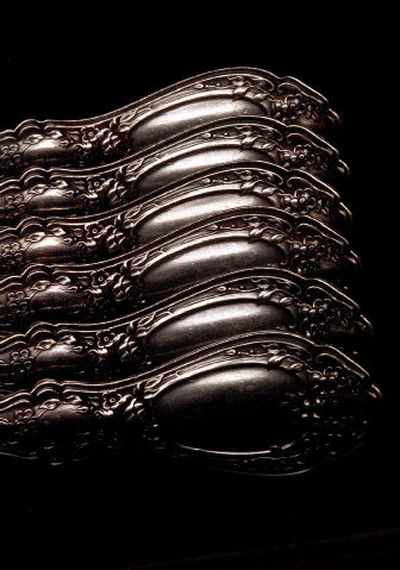 
Spoons glisten in a set of silver-plated flatware, circa 1891 Sharon pattern, at Antiquarian in downtown Spokane. 
 (Brian Plonka / The Spokesman-Review)