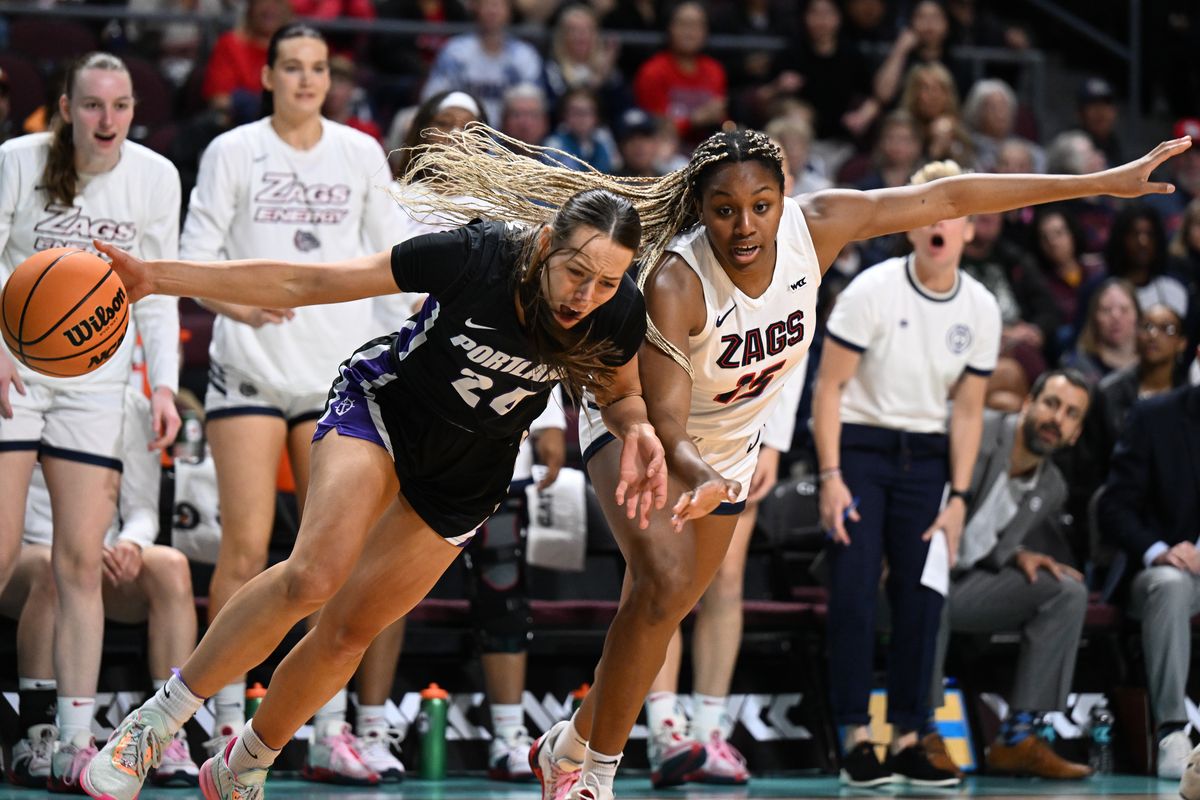 Portland Pilots guard Maisie Burnham (24) drives the ball against Gonzaga Bulldogs forward Yvonne Ejim (15) during the first half of a WCC women’s championship basketball game on Tuesday, Mar 12, 2024, at Orleans Arena in Las Vegas, Nev.  (Tyler Tjomsland/The Spokesman-Review)