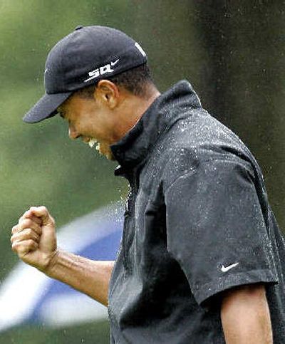 
Tiger Woods celebrates his victory  at the Bridgestone Invitational in Ohio. 
 (Associated Press / The Spokesman-Review)