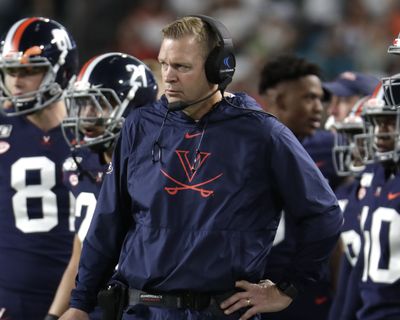 College football coaches, including Virginia's Bronco Mendenhall, are facing the daunting challenge of getting their players to maintain the required focus to prepare for season-openers when the prevailing question swirling around the sport is when, or if, the season will even be played because of the worldwide coronavirus pandemic.  (Lynne Sladky)