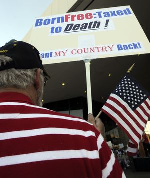 Outside the Spokane Opera House Thursday, Don Stone attends a Constitution Day rally sponsored by the Tea Party organization of Spokane. (Colin Mulvany / The Spokesman-Review)