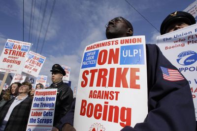 Boeing Co. machinists and supporters  rally last week outside a Boeing administration building in Seattle.  (File Associated Press / The Spokesman-Review)