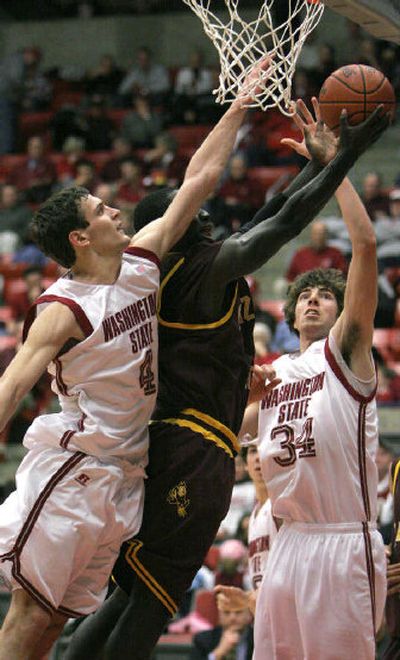 
Cougars Nikola Koprivica, left, and Robbie Cowgill defend Antwi Atuahene's layup attempt for ASU. 
 (Associated Press / The Spokesman-Review)