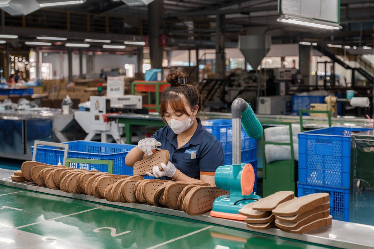 A worker labors on the footbed production on Sept. 10 at a Jones & Vining factory in Dong Nai Province, outside Ho Chi Minh City, Vietnam. Jones & Vining made 120 million footbeds last year. (New York Times)