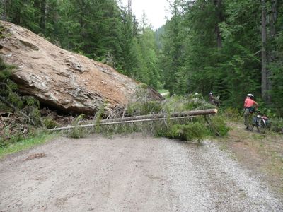 This rock slide has been cleared off Colville National Forest Road 2220, the main access to the Salmo-Priest wilderness trailheads and Gypsy Meadows northeast of Sullivan Lake.  The boulder had blocked vehicle traffic for several weeks. (Courtesy of Jane Baker / The Spokesman-Review)