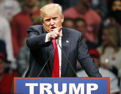 Republican presidential candidate Donald Trump gestures during a speech to a rally in Oklahoma City, Friday, Feb. 26, 2016. (Sue Ogrocki / Associated Press)