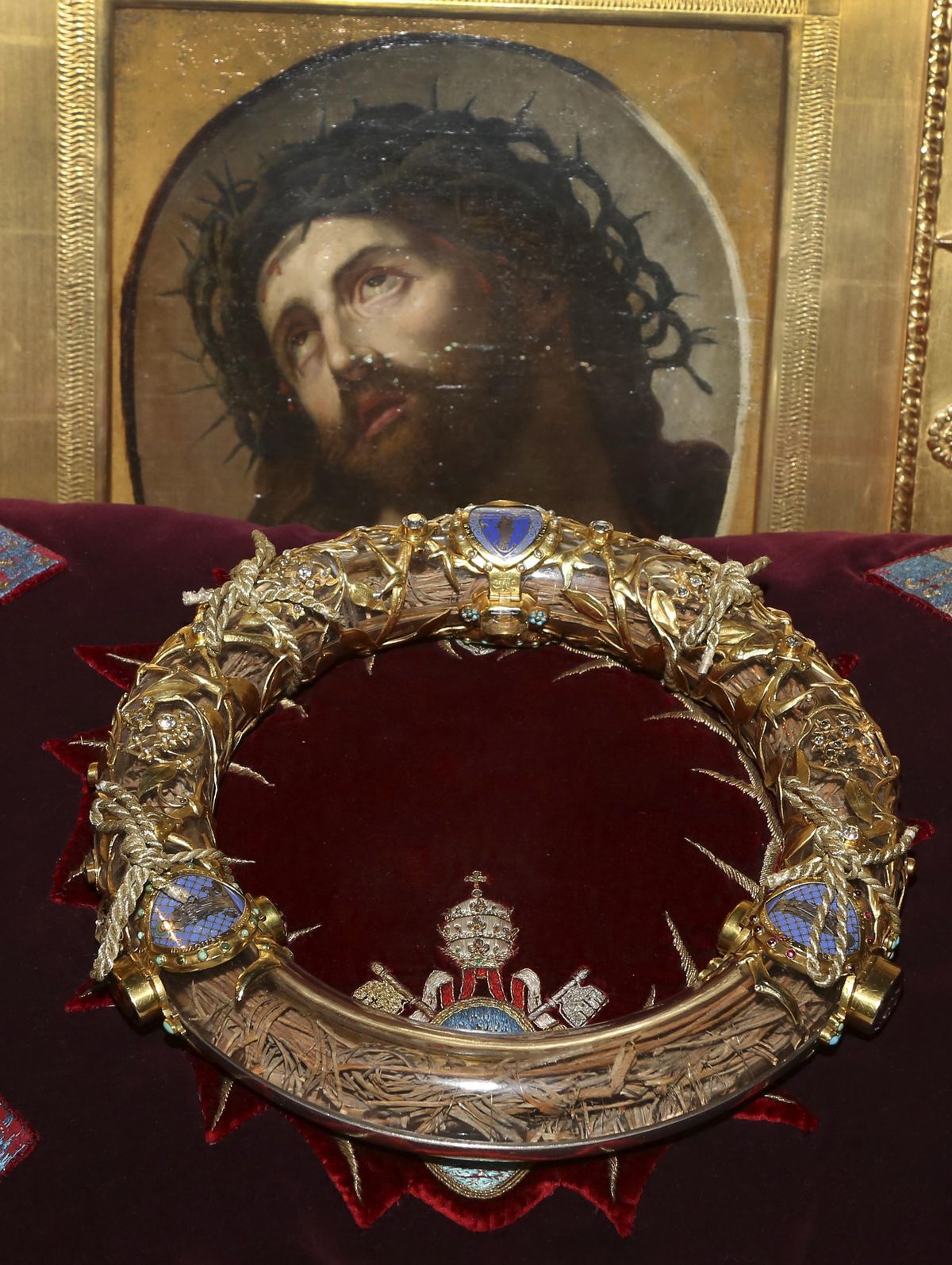 A crown of thorns which was believed to have been worn by Jesus Christ and which was bought by King Louis IX in 1239 is presented at Notre Dame Cathedral in Paris, Friday March 21, 2014. To mark the 800th anniversary of Louis IX's christening, the crown of thorns will be displayed outside Notre Dame, at the Collegiate Church of Poissy, where King Louis IX was christened. (Remy de la Mauviniere / Associated Press)
