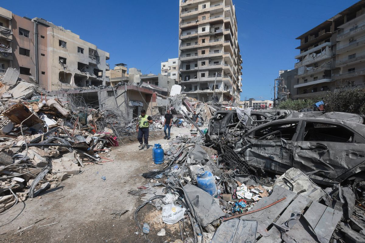 People inspect the damage in the aftermath of an Israeli strike that hit near a hospital on Monday, in Tyre, Lebanon.  (Reuters )