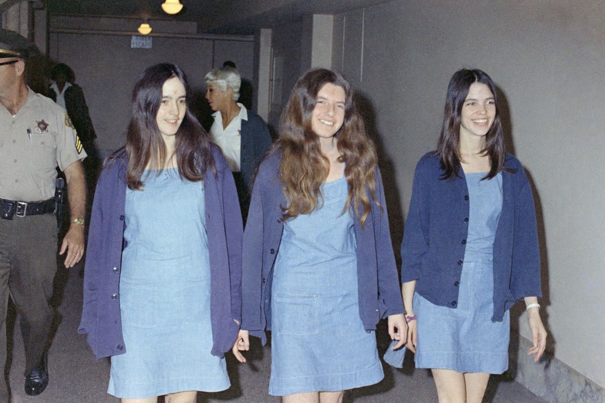In this Aug. 20, 1970  photo, Charles Manson followers, from left: Susan Atkins, Patricia Krenwinkel and Leslie Van Houten, walk to court to appear for their roles in the 1969 cult killings of seven people, including pregnant actress Sharon Tate, in Los Angeles, Calif. (George Brich / Associated Press)
