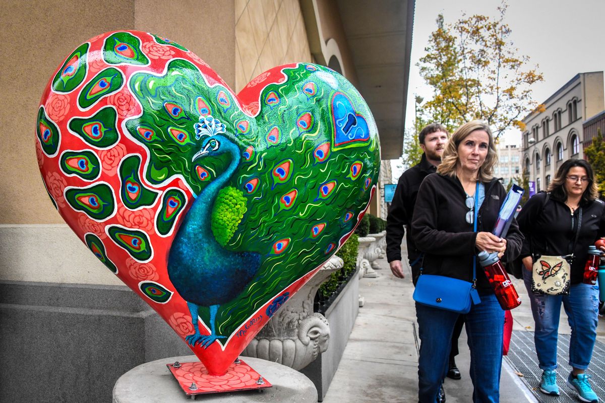 Debbie McCulley’s “Percy Peacock” is included in The Give Love Heart Project facilitated by the Ronald McDonald House Charities of the Inland Northwest. It is placed on the sidewalk outside the Davenport Hotel on Sprague at Post Wall Street, Wednesday, Oct. 31, 2018, in downtown Spokane, Wash. (Dan Pelle / The Spokesman-Review)