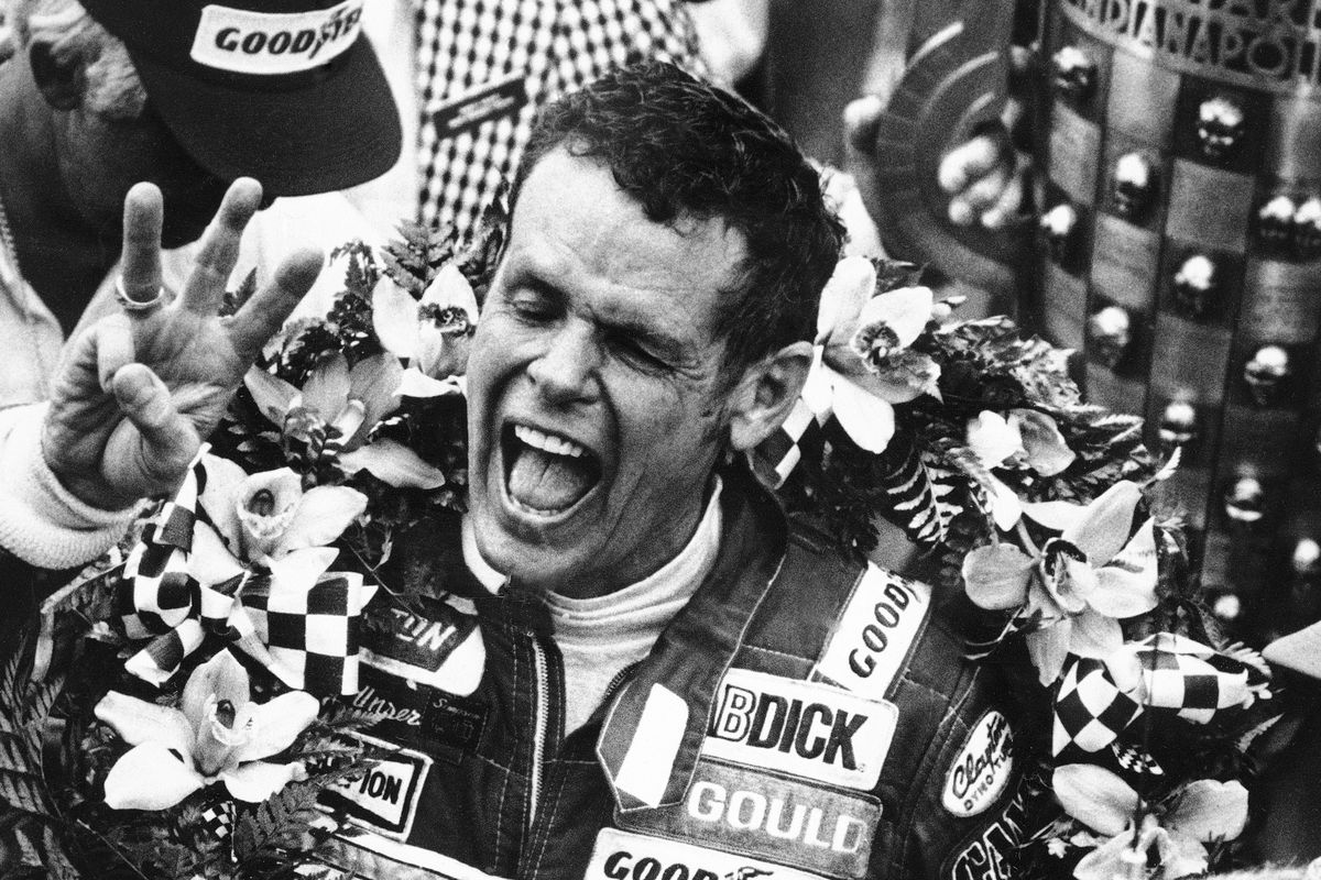 In this May 24, 1981 photo, Bobby Unser holds three fingers aloft after winning his third Indianapolis 500 auto race, in Indianapolis, Ind. Three-time Indianapolis 500 winner Bobby Unser has died. He died of natural causes at his home in Albuquerque, New Mexico, on Sunday, May 2, 2021. He was 87.  (Anonymous)
