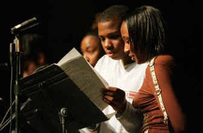 
Berkeley High School students David Thompson, center, and Nickesha Brice read excerpts from 