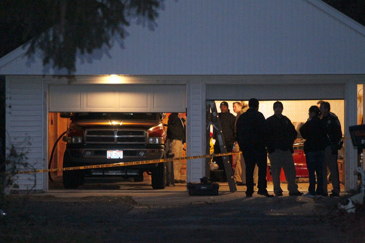 Authorities respond to a report of carbon monoxide poisoning on Harvest Lane in Toledo, Ohio, on Monday, Nov. 12, 2012. The bodies of three children and two adults were found inside the garage Monday, and authorities said they believe the deaths � apparently from carbon monoxide poisoning � weren