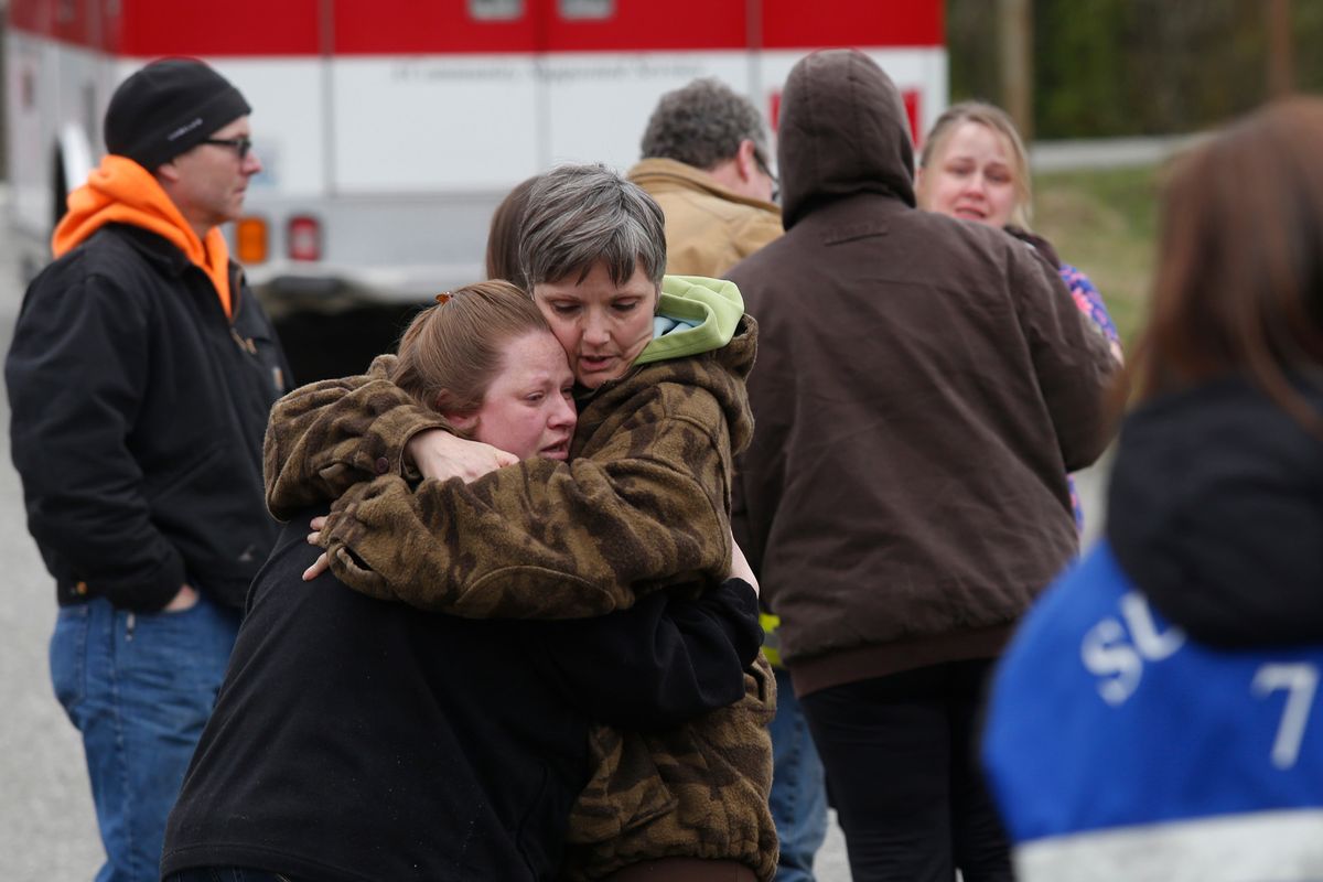 Neighbors console each other at the Oso Fire Department while awaiting updates on the mudslide. (Associated Press)