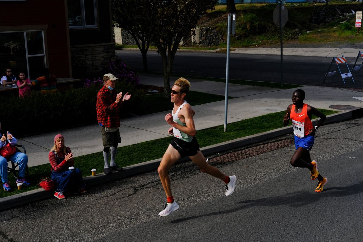 Reid Buchanan leads Charles Wanjiku during Bloomsday on Sunday, May 1, 2022, in downtown Spokane.  (Tyler Tjomsland/The Spokesman-Review)