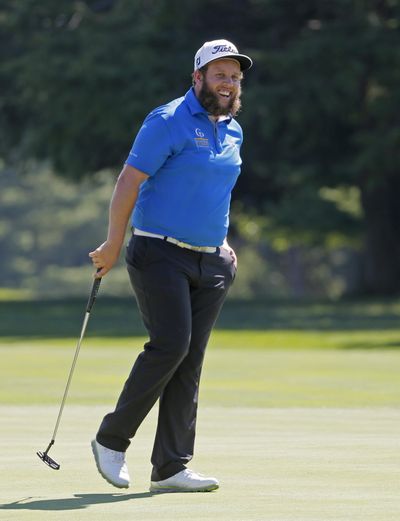 Andrew Johnston, of England, smiles after a putt on the 11th hole during a practice round for the PGA Championship golf tournament at Baltusrol Golf Club in Springfield, N.J., on Tuesday. (Tony Gutierrez / Associated Press)