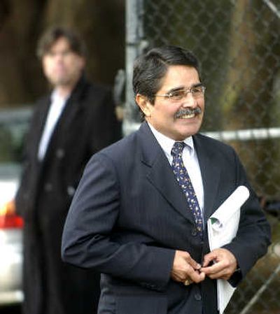 
San Francisco Zoo Director Manuel Mollinedo exits the gates of the zoo to attend a news conference Friday. Associated Press
 (Associated Press / The Spokesman-Review)