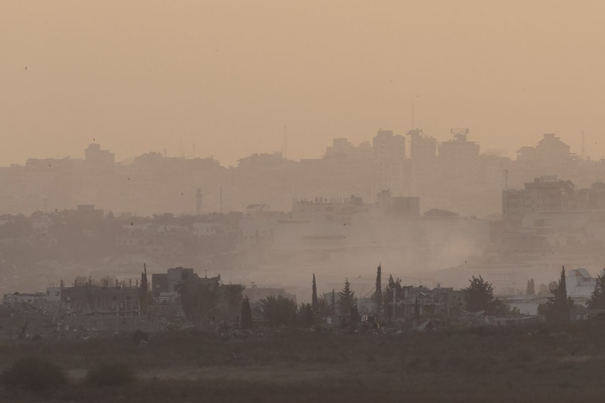 Smoke rises over the Gaza Strip as seen from a position on the Israeli side of the border on Friday in southern Israel.  (Amir Levy)