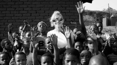 In this image released by the Sundance Channel, pop star Madonna is surrounded by Malawi children in a scene from her documentary, “I Am Because We Are.”  (Associated Press / The Spokesman-Review)
