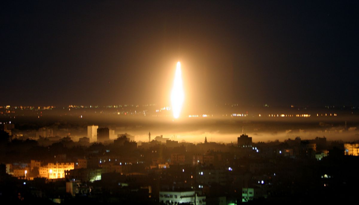 Flare and smoke are seen during an Israeli military operation in downtown Gaza City early this morning. Israel showed no signs of slowing its offensive. Associated Press photos (Associated Press photos / The Spokesman-Review)