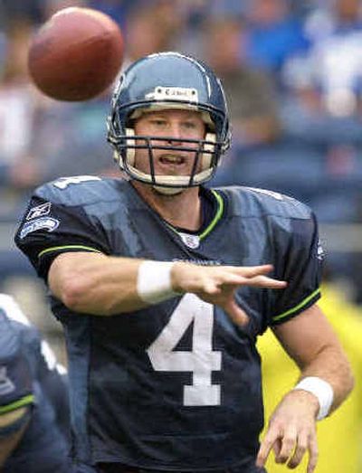 
Quarterback Trent Dilfer will throw the ball for Cleveland next season after being traded Saturday by the Seattle Seahawks. 
 (Associated Press / The Spokesman-Review)