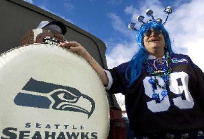 
Wanda Snipes, past president of the Spokane Sea Hawkers and a former Seattle Seahawks season ticket holder, shows off her game day apparel. Snipes will be watching the playoff game this Sunday with her fellow Sea Hawkers at Northern Quest Casino. 
 (Kathryn Stevens / The Spokesman-Review)