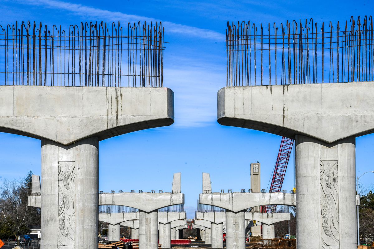 Columns rise from the Spokane Community College parking lot as construction continues on the North Spokane Corridor project Saturday.  (Dan Pelle/THE SPOKESMAN-REVIEW)