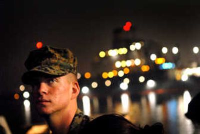 
Awaiting deployment:  Robert Shipp  reflects on the dock at San Diego near the USS Germantown. The native of Hauser Lake, Idaho, was preparing to depart with his 1st Battalion, 5th Marine Regiment. His training indicates he's destined for Afghanistan.
 (Brian Plonka / The Spokesman-Review)