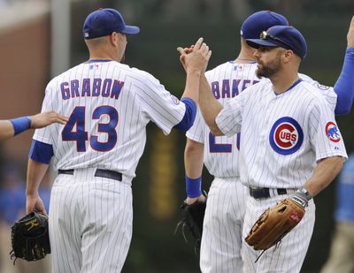 Cubs’ Reed Johnson, right, is batting .349 and attracting a lot of attention from contending teams. (Associated Press)