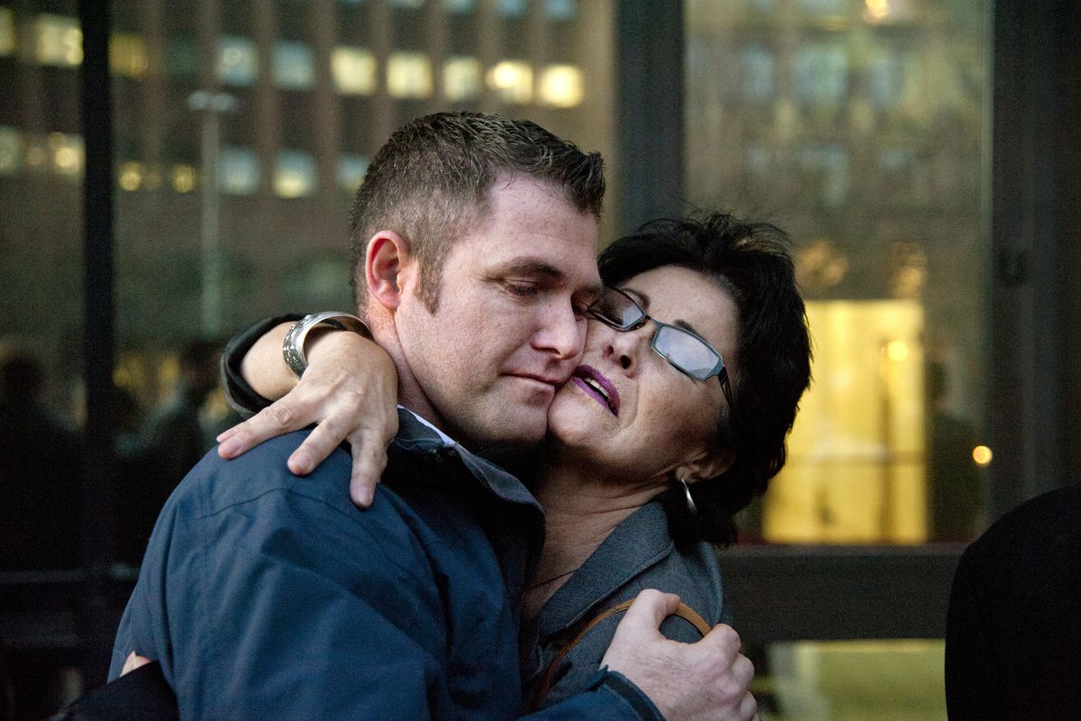 Rhonda Lee Firestack-Harvey embraces her son, Rolland Gregg, after they were acquitted on four of five federal pot charges at the U.S. Courthouse in Spokane. They were convicted on one charge of growing marijuana by a federal jury. (Dan Pelle)