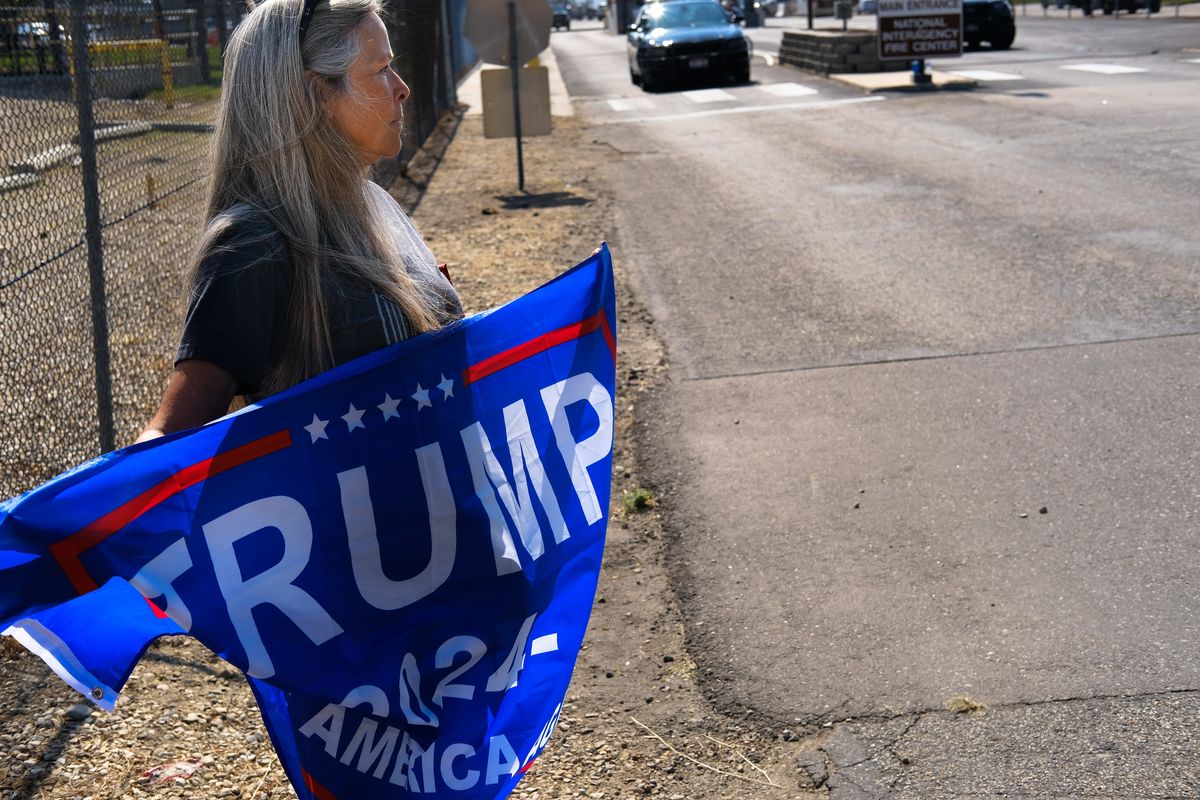 Janice Kohler of Emmett, Idaho, was one of the last protesters remaining on site to rebuke President Joe Biden’s visit to Idaho on Sept. 13, outside the National Interagency Fire Center in Boise.  (Tyler Tjomsland/The Spokesman-Review)