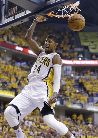 Pacers forward Paul George dunks for two of his 31 second-half points. He had 37 total. (Associated Press)