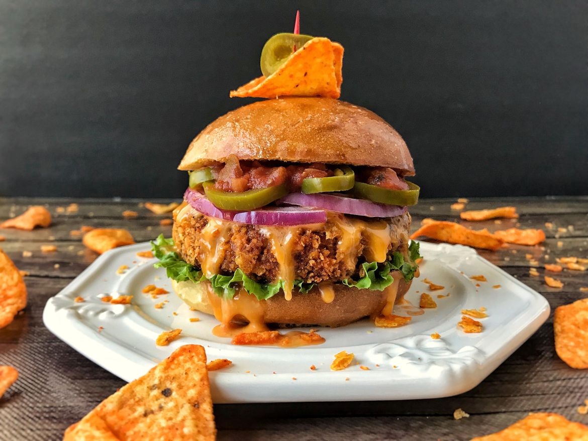 Dorothy Dean presents A burger with Doritos, pepper jack, salsa, nacho cheese, jalapeños and