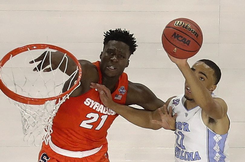 North Carolina's Brice Johnson goes up for a shot against Syracuse's Tyler Roberson during the first half of the Tar Heels’ win on Saturday. (Michael Simmons / Associated Press)