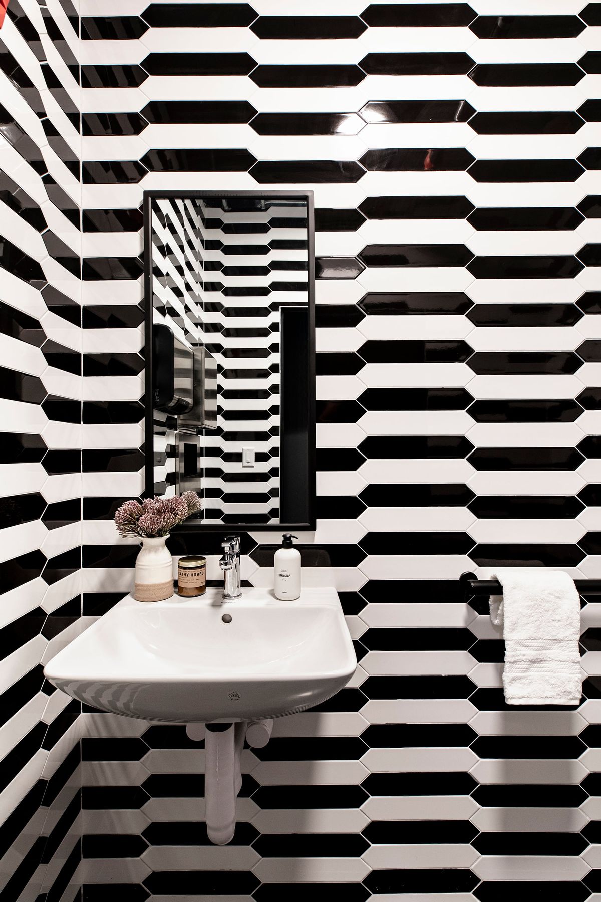Black and white tile laid in a “whimsy” pattern creates a sense of “fun” in this powder room. (Handout/TNS)  (HO)