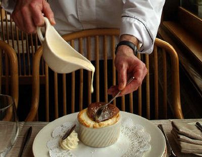 
Chef Jim Barrett, below, of Beverly's at the Coeur d'Alene Resort serves up a huckleberry soufflé. 
 (Photos by Kathy Plonka / The Spokesman-Review)