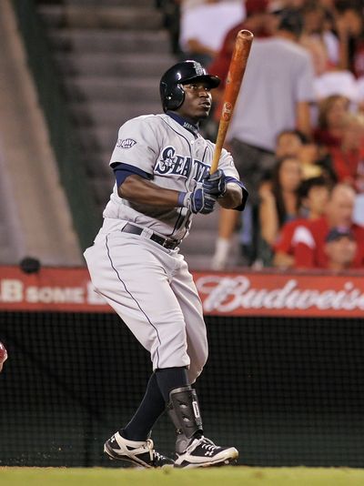 Seattle Mariners' Trayvon Robinson hits a solo home run in the sixth inning of their baseball game against the Los Angeles Angels, Wednesday, Sept. 7, 2011, in Anaheim. (Mark Terrill / Associated Press)