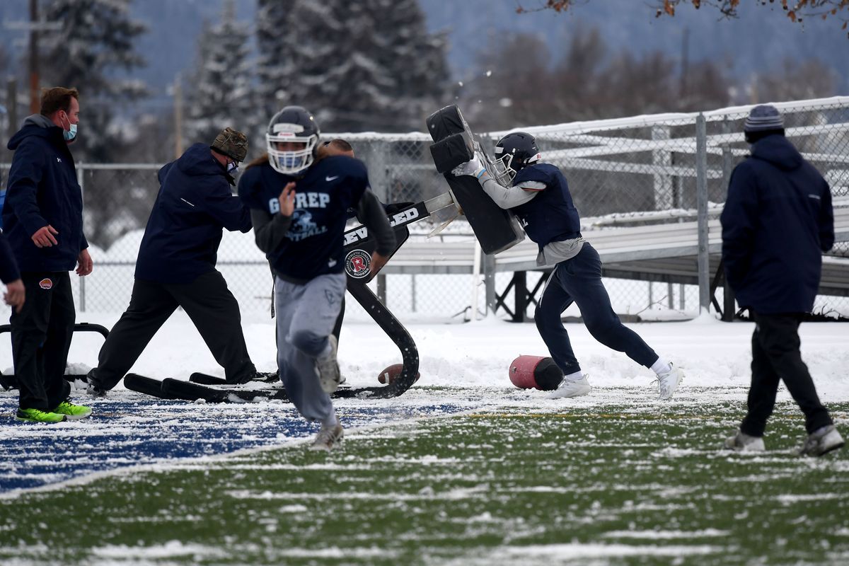 The Gonzaga Prep football team practices on a frozen, snow-covered field during the first day of spring football practice, Monday, Feb.15, 2021.  (COLIN MULVANY/THE SPOKESMAN-REVIEW)