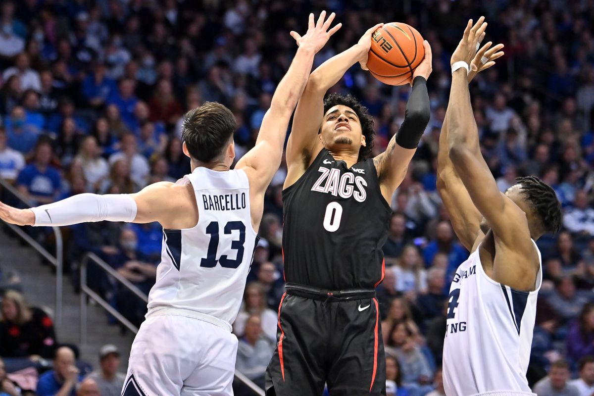 Gonzaga guard Julian Strawther, who finished with 19 points, shoots against BYU guard Alex Barcello during the second half Saturday in Provo, Utaho.  (Tyler Tjomsland/The Spokesman-Review)