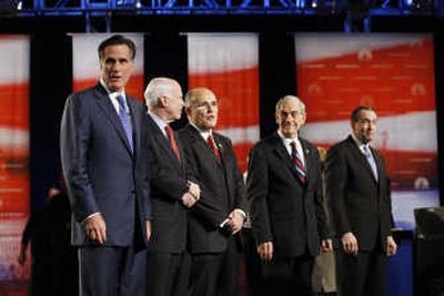 
Republican presidential hopefuls Mitt Romney, John McCain, Rudy Giuliani, Ron Paul and Mike Huckabee, from left, line up before their debate Thursday at Florida Atlantic University.  
 (Associated Press / The Spokesman-Review)