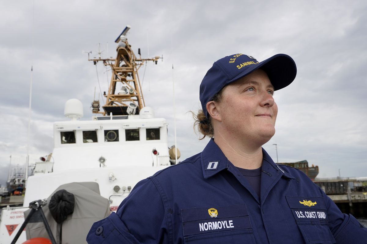 U.S. Coast Guard Lt. Kelli Normoyle, Commanding Officer of the Coast Guard Cutter Sanibel, stands for a photograph Thursday on the deck of the vessel at a shipyard, in North Kingstown, R.I.  (Steven Senne)