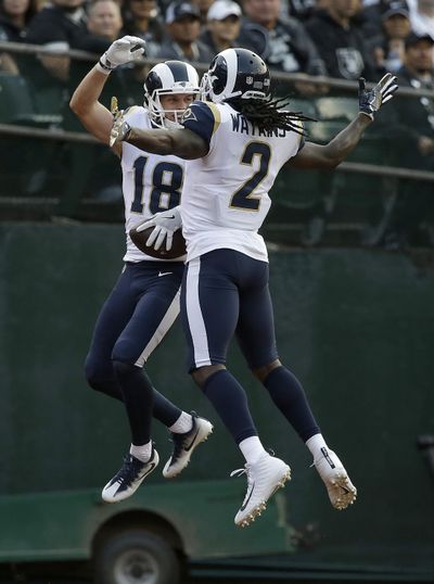 Los Angeles Rams wide receiver Cooper Kupp (18) celebrates with Sammy Watkins after catching a touchdown pass against the Oakland Raiders during the first half of an NFL preseason football game in Oakland, Saturday, Aug. 19, 2017. (Rich Pedroncelli / Associated Press)