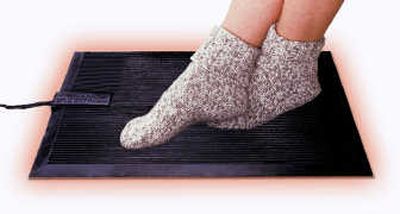
If you are among those who spend a lot of time sitting or standing with your feet on a cold floor, the Cozy Footwarmer is a heating pad you can stand on or rest your feet on.
 (ARA / The Spokesman-Review)