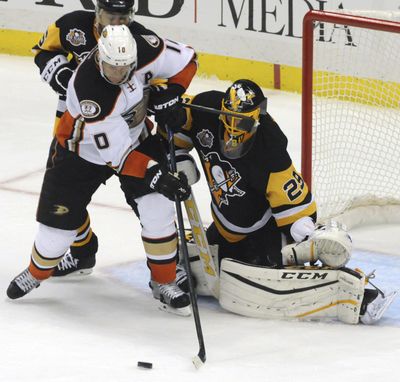 Anaheim’s Corey Perry has his shot stopped by Pittsburgh goalie Marc-Andre Fleury during the second period. (John Heller / Associated Press)